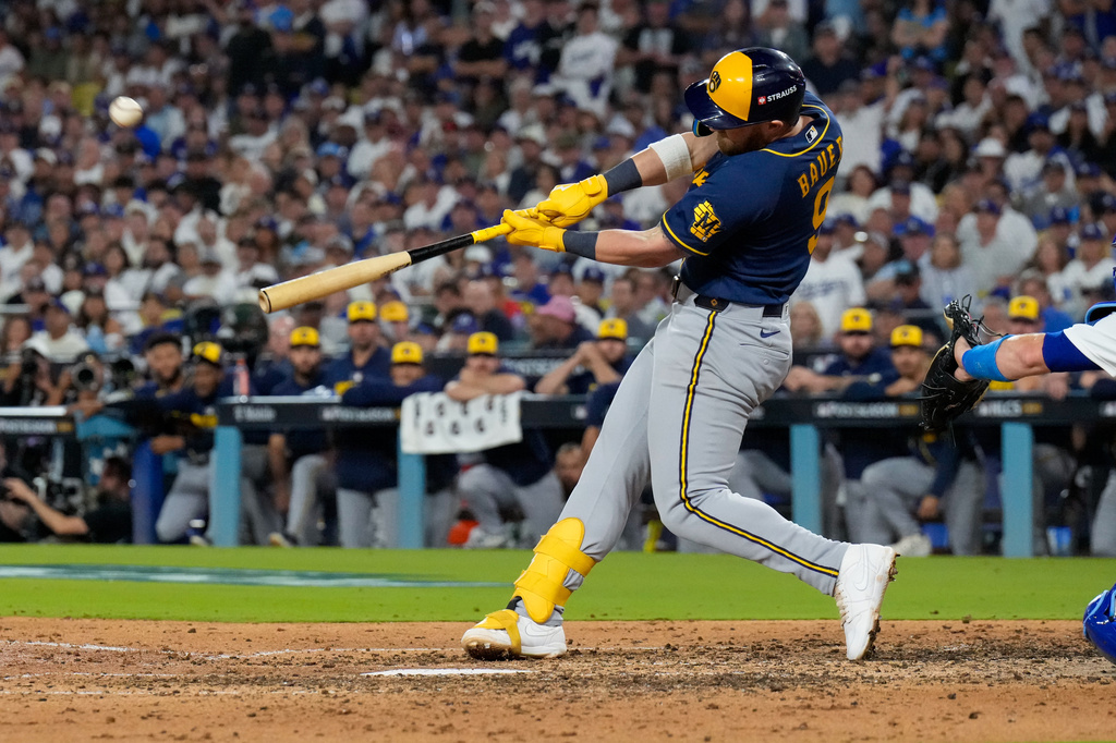 Milwaukee Brewers first baseman Jake Bauers connects for a two run home run during the seventh inning of Game 3 of baseball's National League Championship Series between the Milwaukee Brewers and the Los Angeles Dodgers, Wednesday, Oct. 14, 2026, in Los Angeles. (AP Photo/Ashley Landis)
