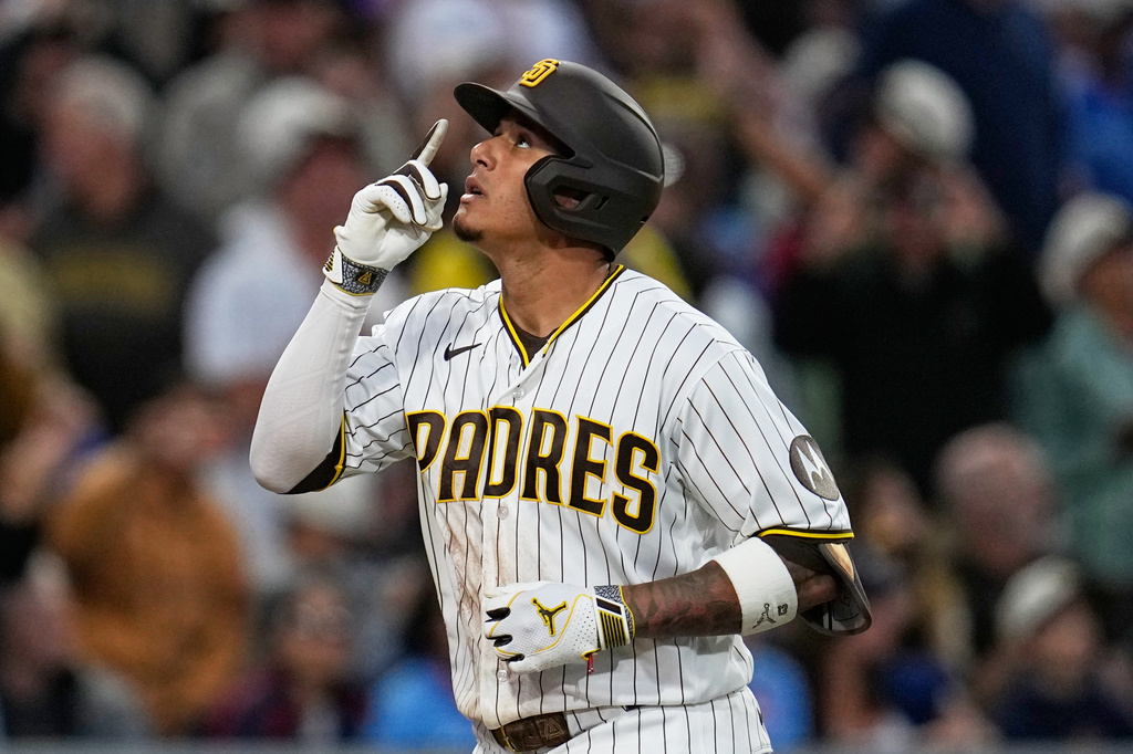 San Diego Padres' Manny Machado celebrates after hitting a home run during the fourth inning of a baseball game against the Atlanta Braves Monday, June 22, 2026, in San Diego. (AP Photo/Gregory Bull)