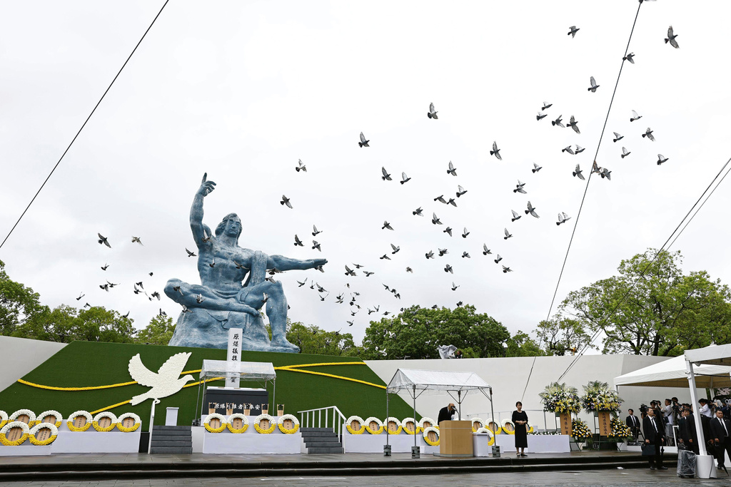 Doves are leased over the Peace Statue during a ceremony to mark the 80th anniversary of the U.S. atomic bombing at the Peace Park in Nagasaki, southern Japan Saturday, Aug. 9, 2025. (Kotaro Ueda/Kyodo News via AP)