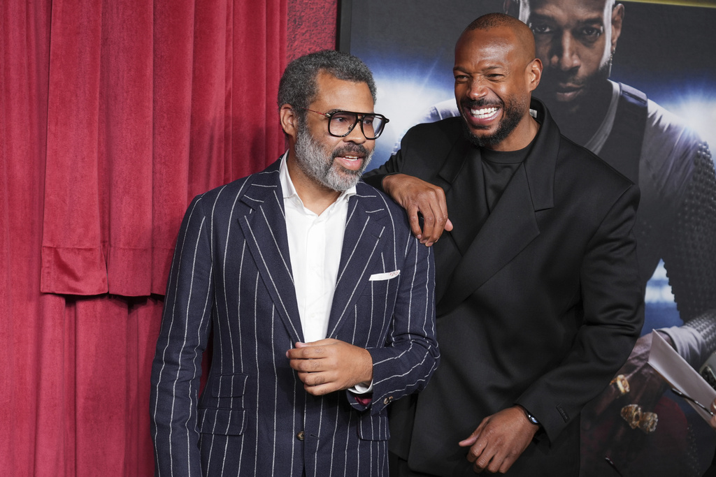 Jordan Peele, left, and Marlon Wayans arrive at the premiere of "Him" on Wednesday, Sept. 17, 2025, at TCL Chinese Theatre in Los Angeles. (AP Photo/Chris Pizzello)