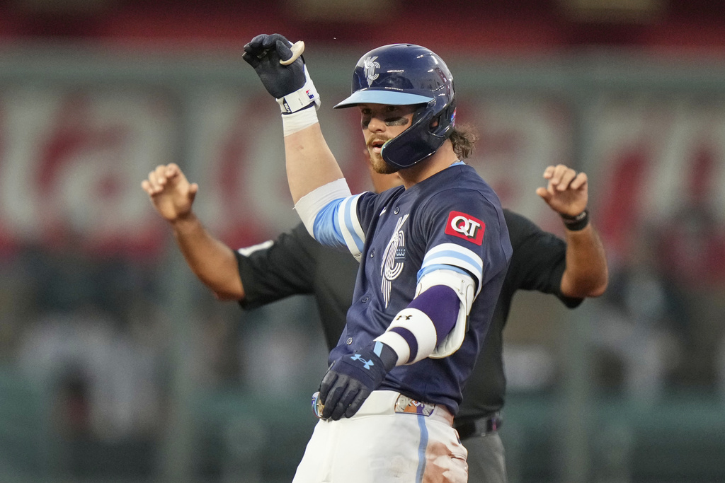 Kansas City Royals' Bobby Witt Jr. celebrates at second after hitting a double during the third inning of a baseball game against the Chicago White Sox, Friday, Aug. 15, 2025, in Kansas City, Mo. (AP Photo/Charlie Riedel)