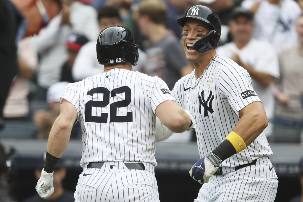 New York Yankees' Aaron Judge, right, celebrates with Ben Rice (22) after Rice hit a three-run home run during the first inning of a baseball game against the Toronto Blue Jays, Sunday, Sept. 7, 2025, in New York. (AP Photo/Heather Khalifa)