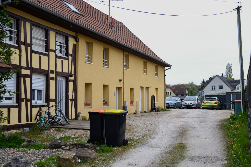 Outside view of the building and the parking area where a 9-year-old boy was rescued after living locked in his father's utility van since 2024, in Hagenbach, Eastern France, Saturday, April 11, 2026. (AP Photo)