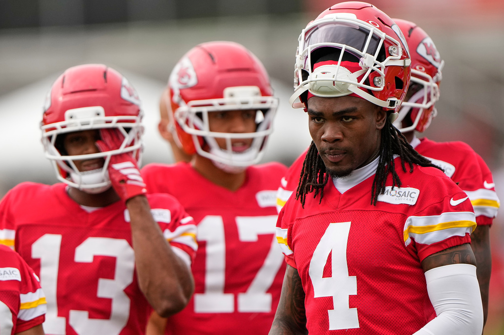 Kansas City Chiefs wide receiver Rashee Rice (4) waits with teammates to start a drill during NFL football training camp Friday, July 31, 2026, in St. Joseph, Mo. (AP Photo/Charlie Riedel)