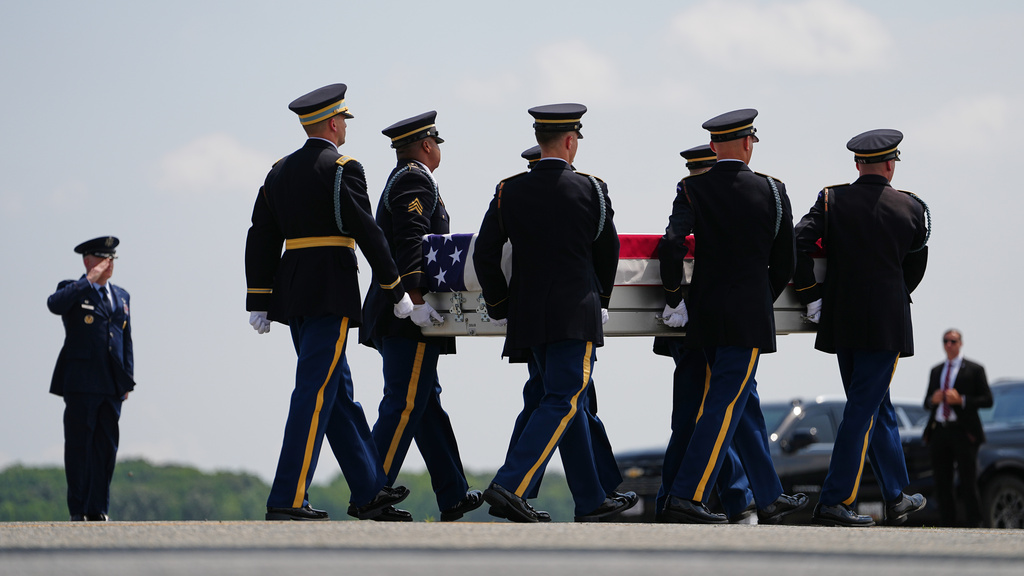 A U.S. Army carry team moves a transfer case containing the remains of 1st Lt. Tyler James Feehan of Ewa Beach, Hawaii, Wednesday, July 22, 2026, at Dover Air Force Base, Del. (AP Photo/Matt Rourke)