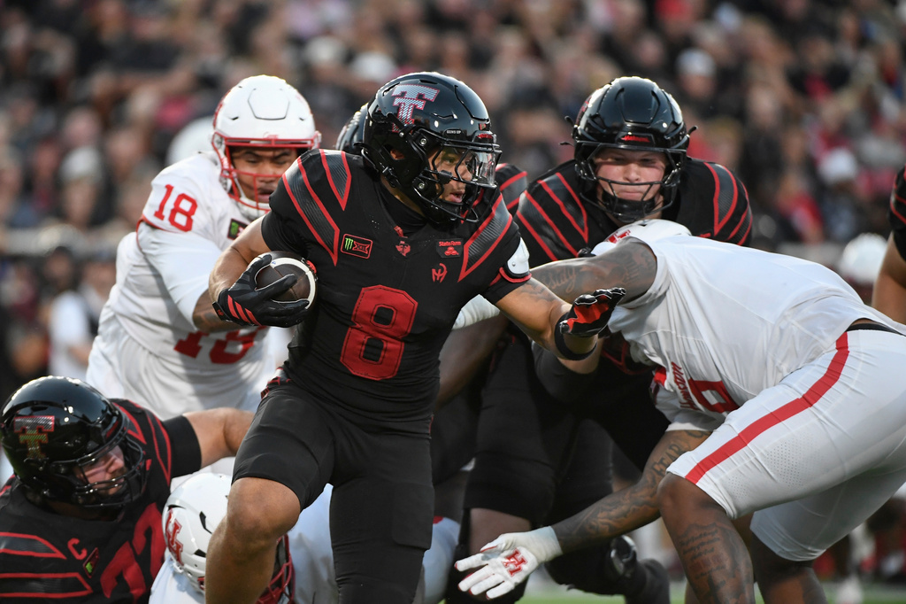 Texas Tech running back Cameron Dickey (8) runs the ball against Houston during the first half of an NCAA college football game Friday, Sept. 18, 2026, in Lubbock, Texas. (AP Photo/Justin Rex)