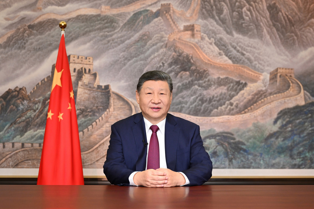 In this photo released by Xinhua News Agency, Chinese President Xi Jinping delivers his 2026 New Year message in Beijing on Wednesday, Dec. 31, 2025. (Yan Yan/Xinhua via AP)