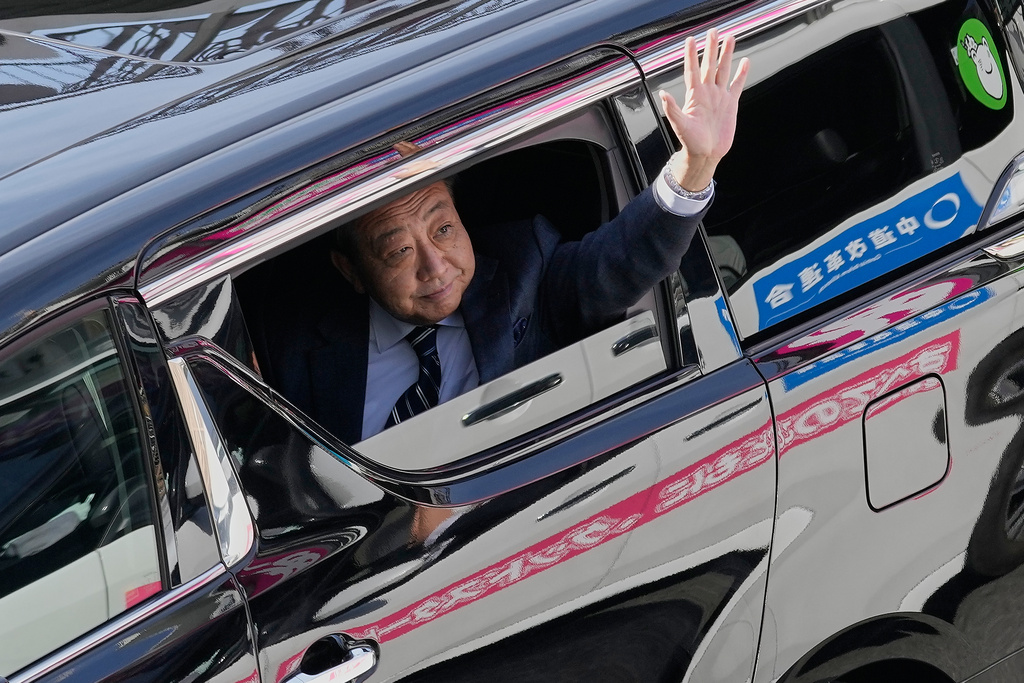 Yoshihiko Noda, one of the co-leaders of the newly formed Japanese political party Centrist Reform Alliance, waves to the passersby after delivering a speech in support of the party's candidate for the lower house election in Fujisawa, Kanagawa Prefecture, south of Tokyo Thursday, Feb. 5, 2026, in Tokyo. (AP Photo/Eugene Hoshiko)