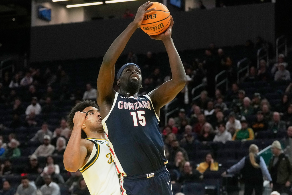 Gonzaga forward Graham Ike (15) shoots against San Francisco forward David Fuchs during the first half of an NCAA college basketball game in San Francisco, Wednesday, Feb. 18, 2026. (AP Photo/Jeff Chiu)