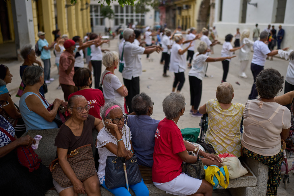 Elderly residents watch a tai chi class for seniors at the Belen Convent in Old Havana, Cuba, Thursday, Feb. 20, 2025. (AP Photo/Ramon Espinosa)