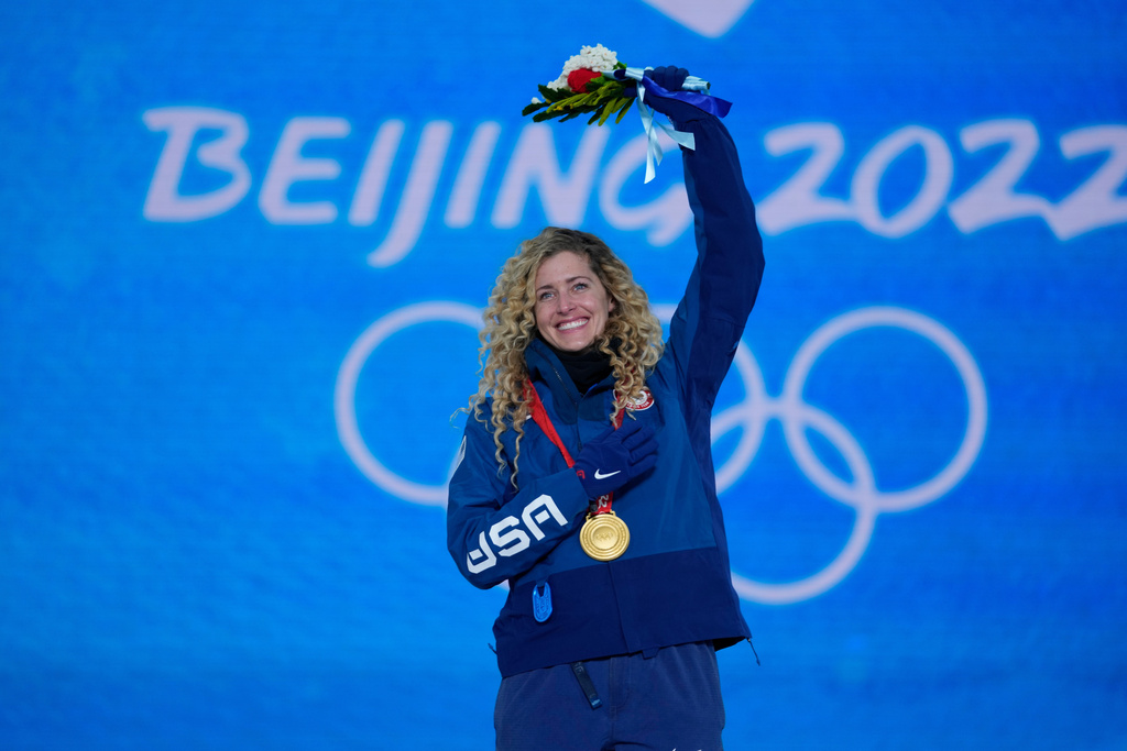 FILE - Lindsey Jacobellis acknowledges the crowd during a medal ceremony for the women's snowboard cross finals competition at the 2022 Winter Olympics, Feb. 9, 2022, in Zhangjiakou, China. (AP Photo/Frank Augstein, File)
