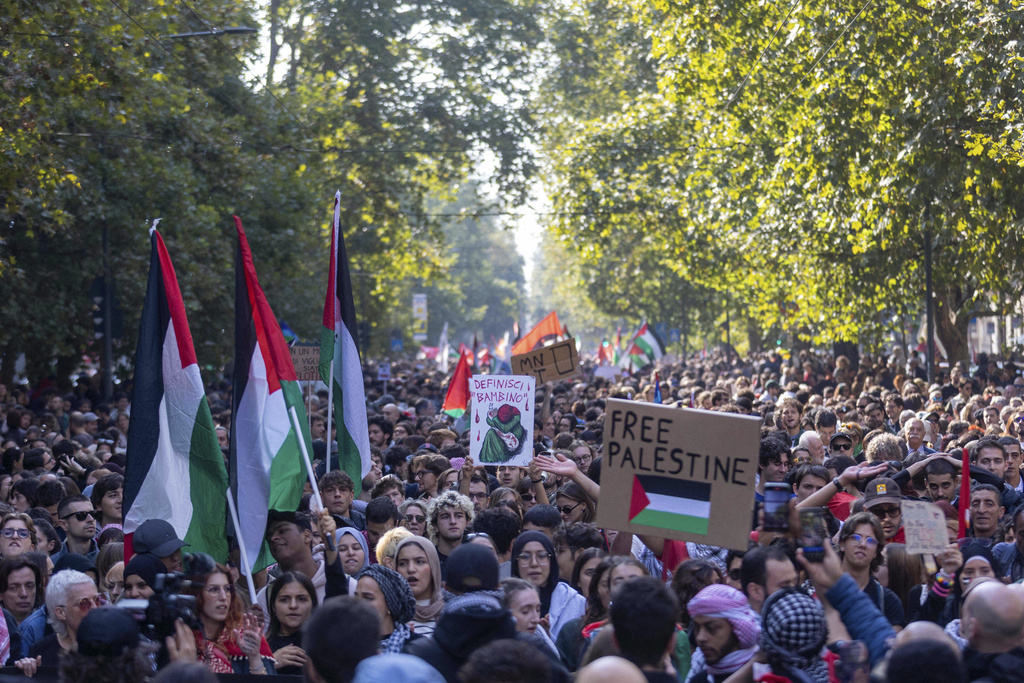Demonstrators march on the occasion of a general strike in solidarity with the Palestinian people and the flotilla, in Milan, Italy, Friday, Oct. 3 2025. (Stefano Porta/LaPresse via AP)