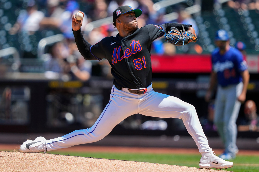 New York Mets pitcher Freddy Peralta (51) throws during the first inning of a baseball game against the Los Angeles Dodgers, Sunday, July 26, 2026, in New York. (AP Photo/Yuki Iwamura)