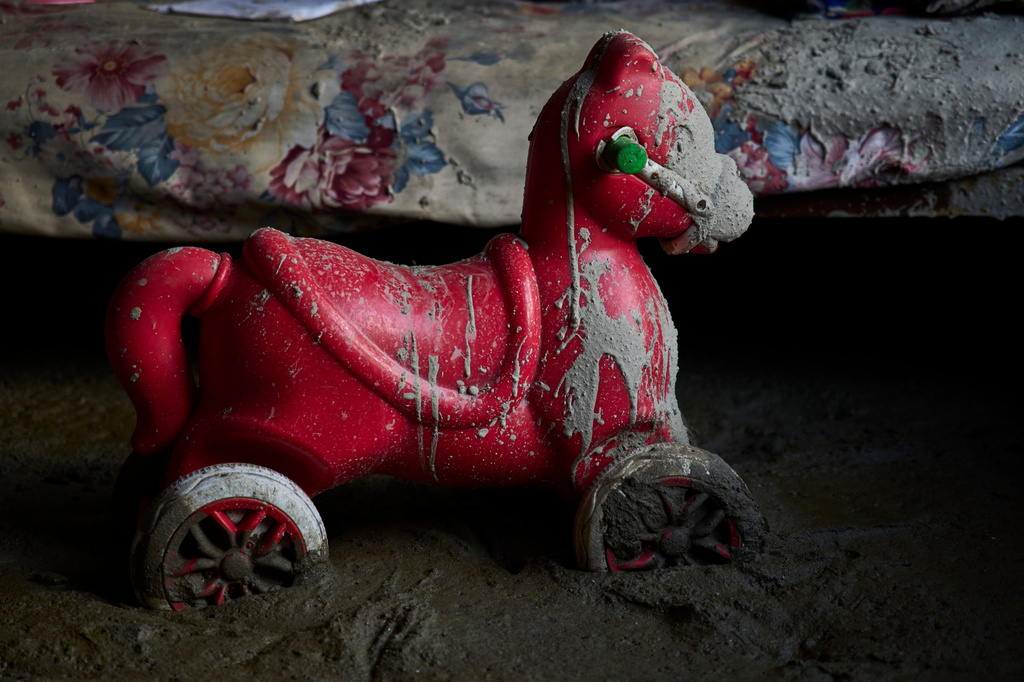 A mud-stained toy lies on the floor of a classroom inside the flood-damaged Uttargaya School in Nepal's Nuwakot district, Tuesday, Sept. 22, 2026. (AP Photo/Niranjan Shrestha)