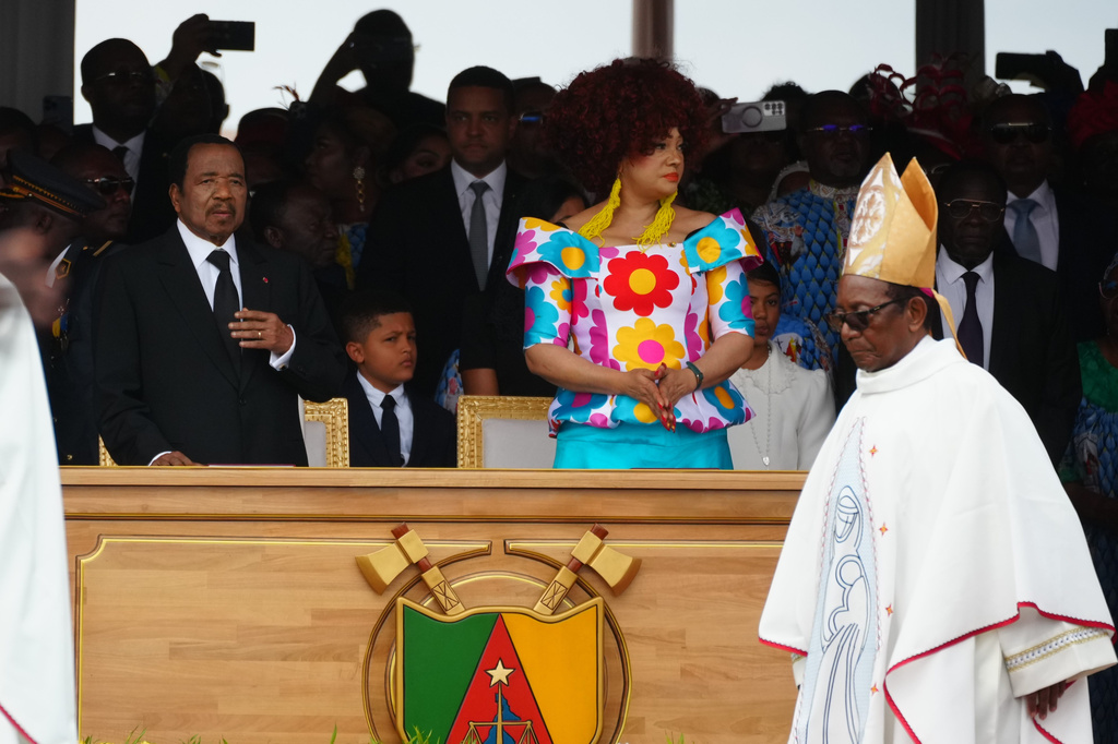 Cameroon's President Paul Biya, left, and his wife Chantal wait for the start of a Mass celebrated by Pope Leo XIV at Yaounde Ville Airport, Cameroon, Saturday, April 18, 2026 on the sixth day of his 11-day pastoral visit to Africa. (AP Photo/Andrew Medichini)