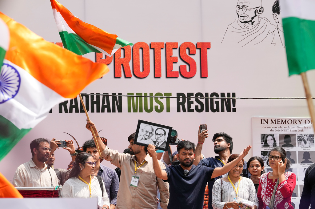 Abhijeet Dipke, center, founder of the Cockroach Janta Party addresses supporters during a protest demanding the resignation of Education Minister Dharmendra Pradhan over alleged examination irregularities and repeated paper leaks, in New Delhi, India, Saturday, June 20, 2026. (AP Photo/Manish Swarup)
