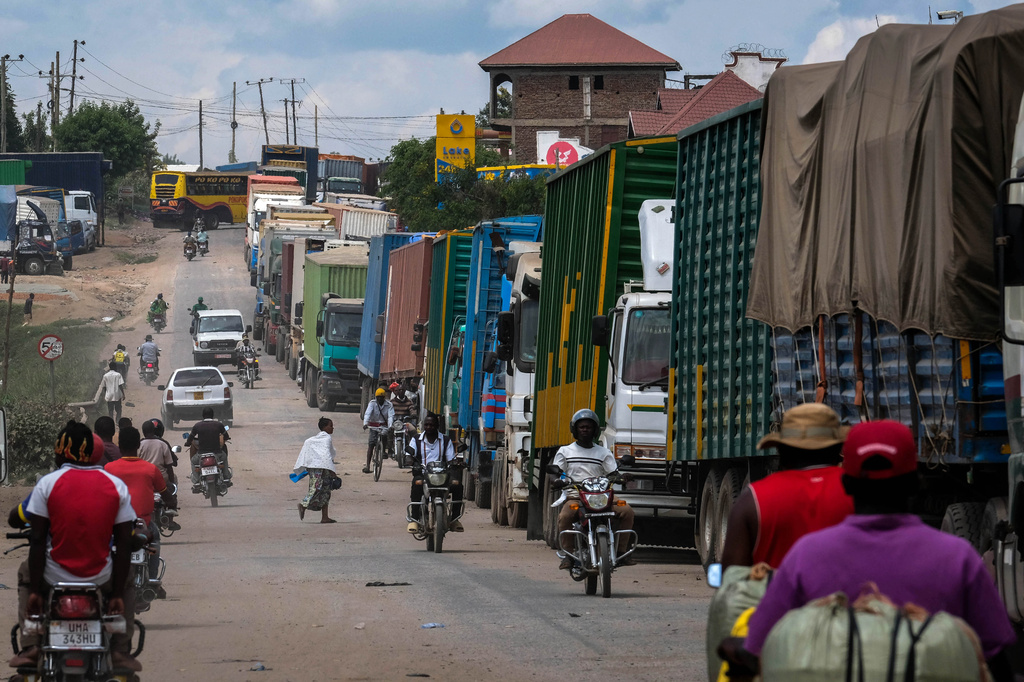 Cargo trucks queue up at the Mpondwe border crossing linking Uganda and the Democratic Republic of the Congo, Thursday, June 4, 2026. (AP Photo/Hajarah Nalwadda)