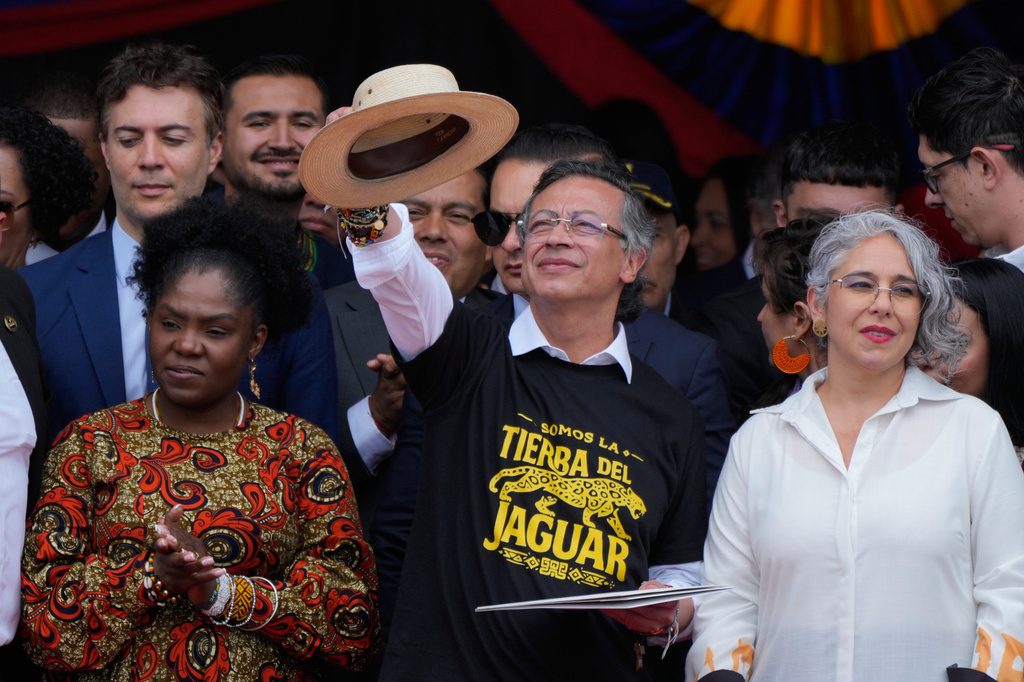 President Gustavo Petro addresses supporters, flanked by Vice President Francia Marquez, left, and Sen. Maria Jose Pizarro, right, after a military parade marking Colombia's Independence Day in Bogota, Colombia, Monday, July 20, 2026. (AP Photo/Fernando Vergara)