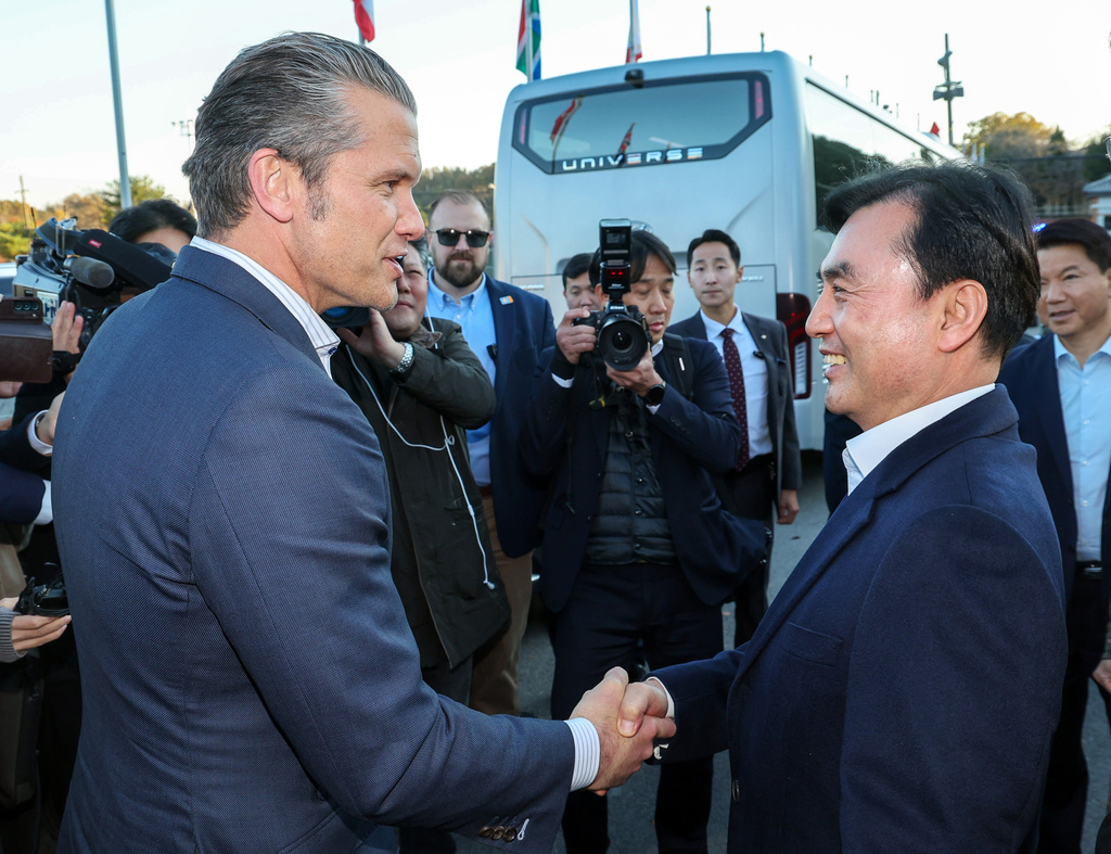 U.S. Defense Secretary Pete Hegseth, left, shakes hands with South Korean Defense Minister Ahn Gyu-back upon arrival at the Camp Bonifas near the border village of Panmunjom in Paju, South Korea, Monday, Nov. 3, 2025. (Yonhap via AP)