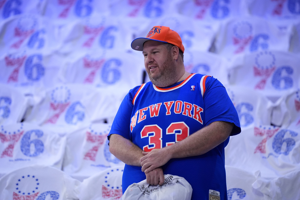 A New York Knicks' fan watches warm-ups before Game 3 in a second-round NBA basketball playoff series against the Philadelphia 76ers Friday, May 8, 2026, in Philadelphia. (AP Photo/Matt Slocum)