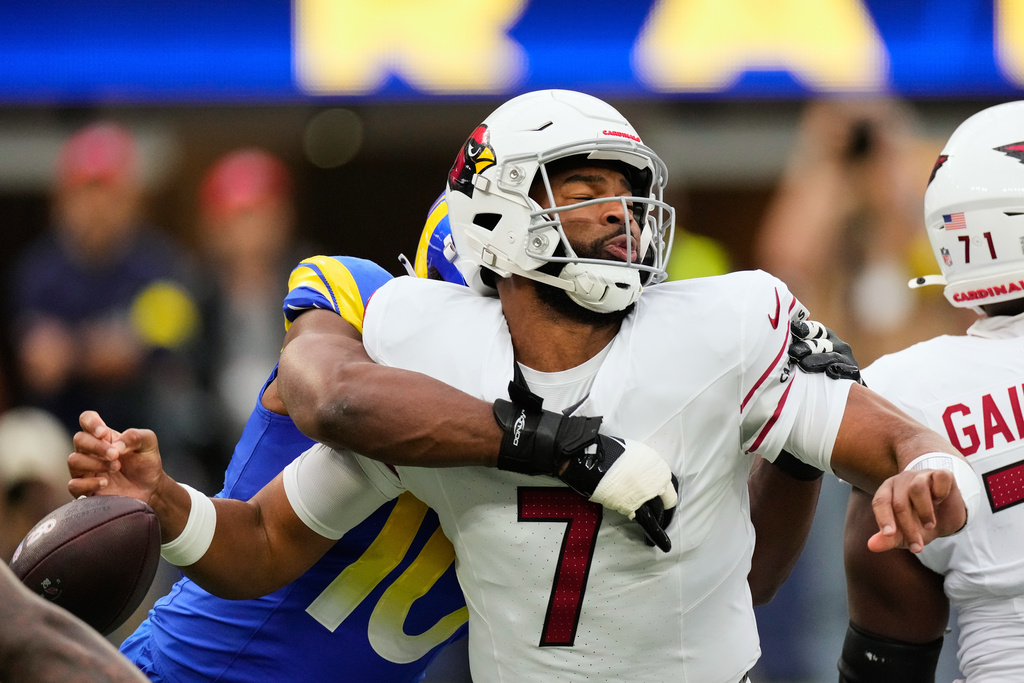 Arizona Cardinals quarterback Jacoby Brissett (7) fumbles the ball while being sacked by Los Angeles Rams linebacker Josaiah Stewart (10) during the first half of an NFL football game, Sunday, Jan. 4, 2026, in Inglewood, Calif. (AP Photo/Mark J. Terrill)