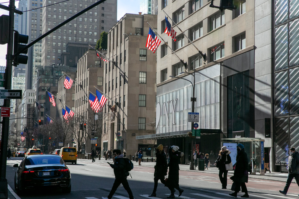 FILE - American flags wave in the wind on Fifth Avenue in the borough of Manhattan in New York City on Friday, Jan. 21, 2022. (AP Photo/Ted Shaffrey, file)