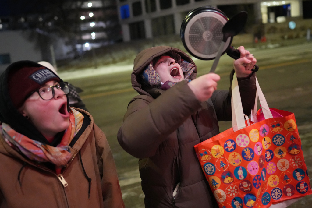 People take part in a noise demonstration protest in response to federal immigration enforcement operations in the city Sunday, Jan. 25, 2026, in Minneapolis. (AP Photo/Adam Gray)