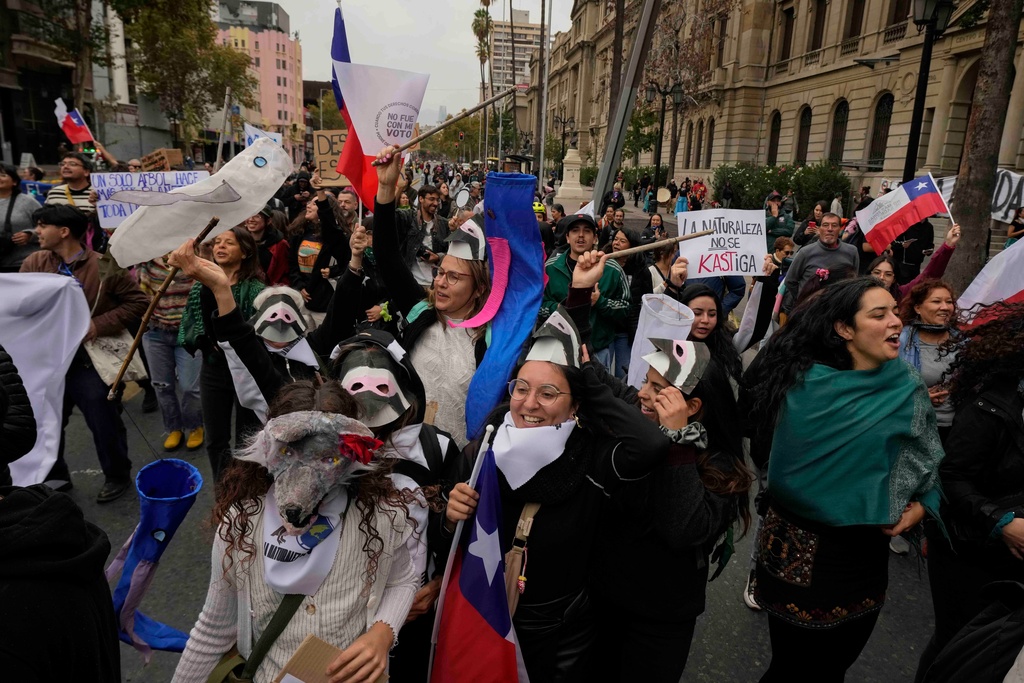 Protesters march during World Water Day demanding greater environmental protection and animal welfare, in Santiago, Chile, Sunday, March 22, 2026. (AP Photo/Esteban Felix)