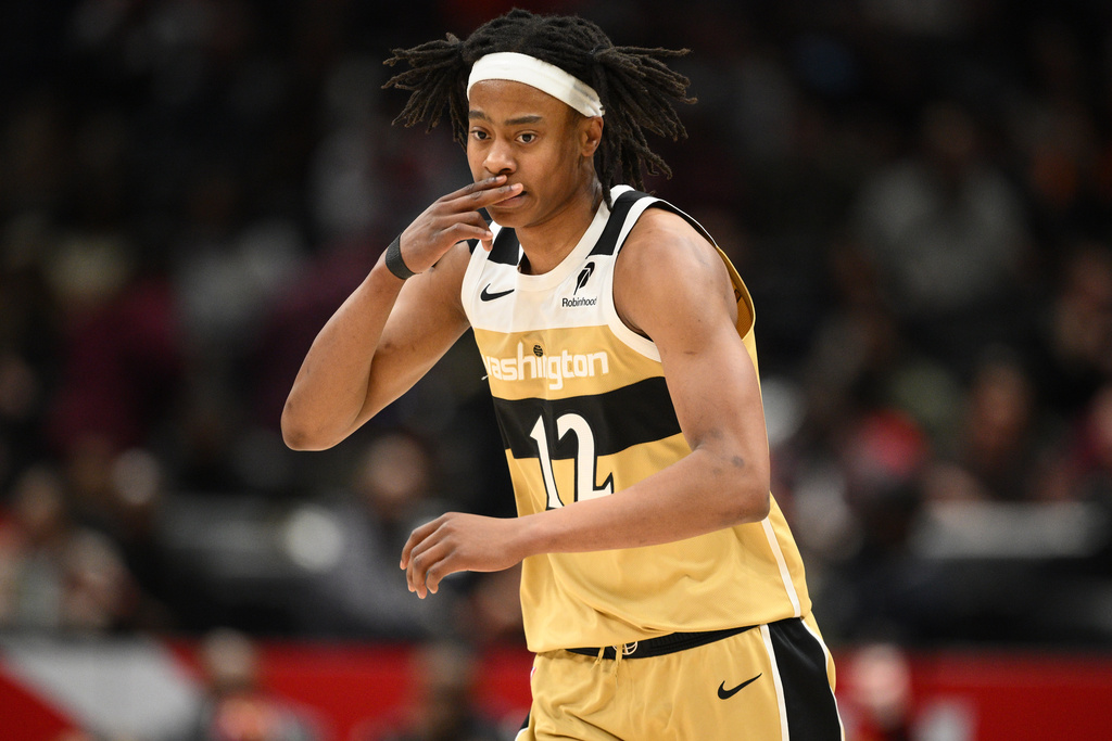 Washington Wizards guard Tre Johnson gestures after he made a basket during the first half of an NBA basketball game against the Toronto Raptors, Saturday, Feb. 28, 2026, in Washington. (AP Photo/Nick Wass)
