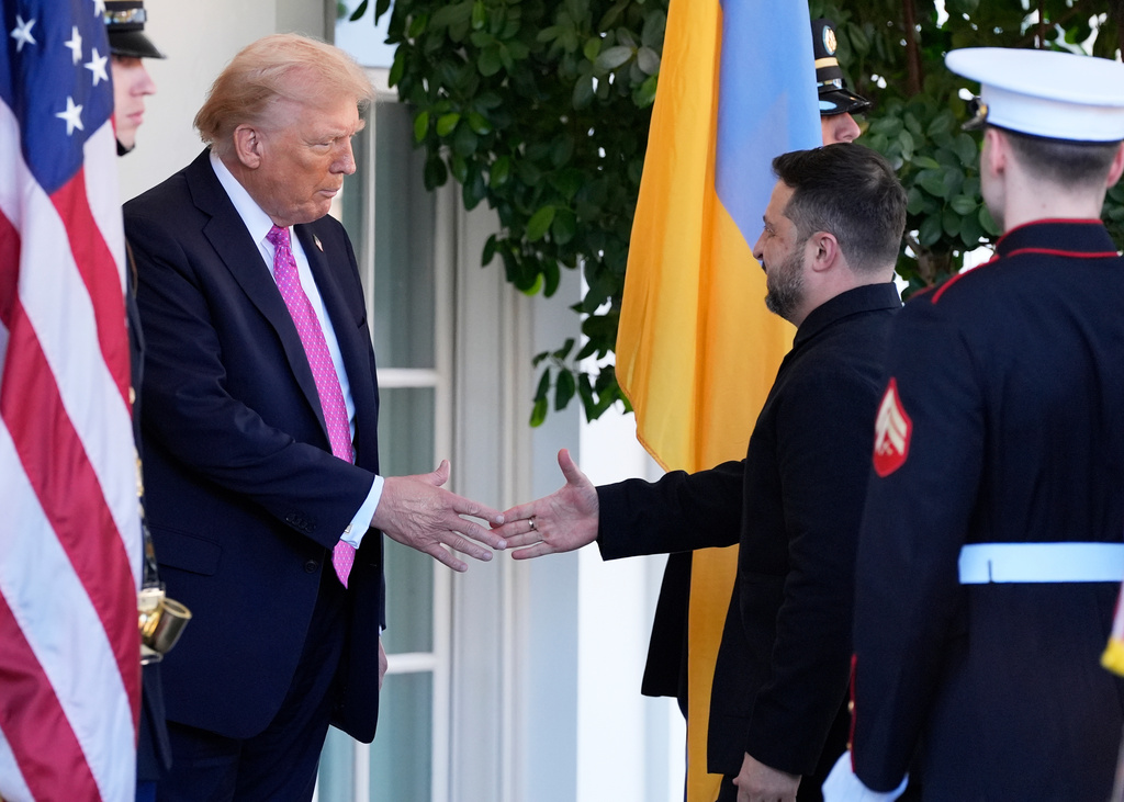 President Donald Trump, left, greets Ukraine's President Volodymyr Zelenskyy at the White House, Friday, Oct. 17, 2025, in Washington. (AP Photo/Alex Brandon)