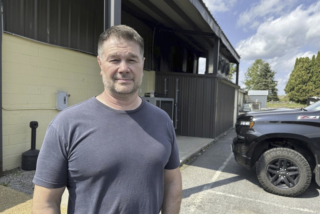 Lenny Schmidt stands outside his food manufacturing facility that was raided by federal law enforcement officers Friday, Sept. 5, 2025, in Cato, N.Y. (AP Photo/Michael Hill)