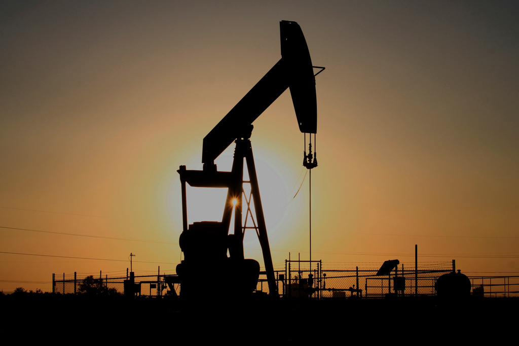 FILE - A pump jack operates at sunset in the Permian Basin near Loving, N.M., May 20, 2025. (AP Photo/Susan Montoya Bryan, file)