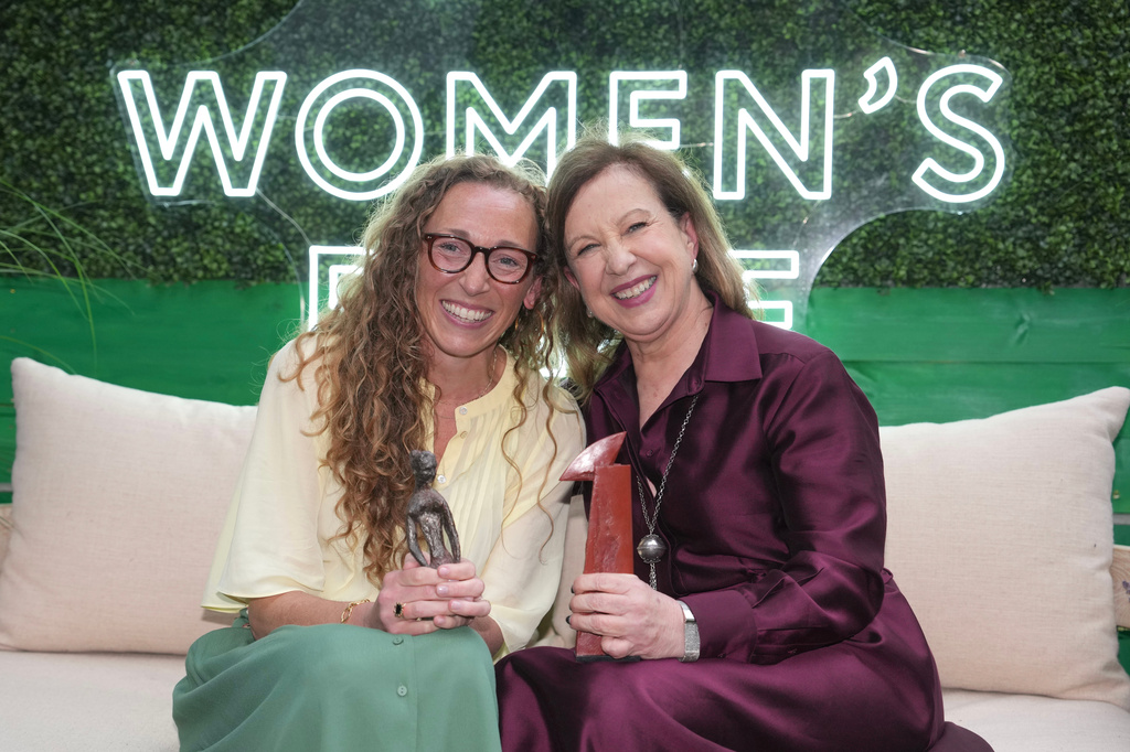 Virginia Evans, left, and Lyse Doucet winners of The Women's Prize for fiction, left, and nonfiction, pose for a photograph at the 2026 Women's Prize Trust Summer Party & Awards Ceremony in London, Thursday, June 11, 2026. (AP Photo/Kin Cheung)