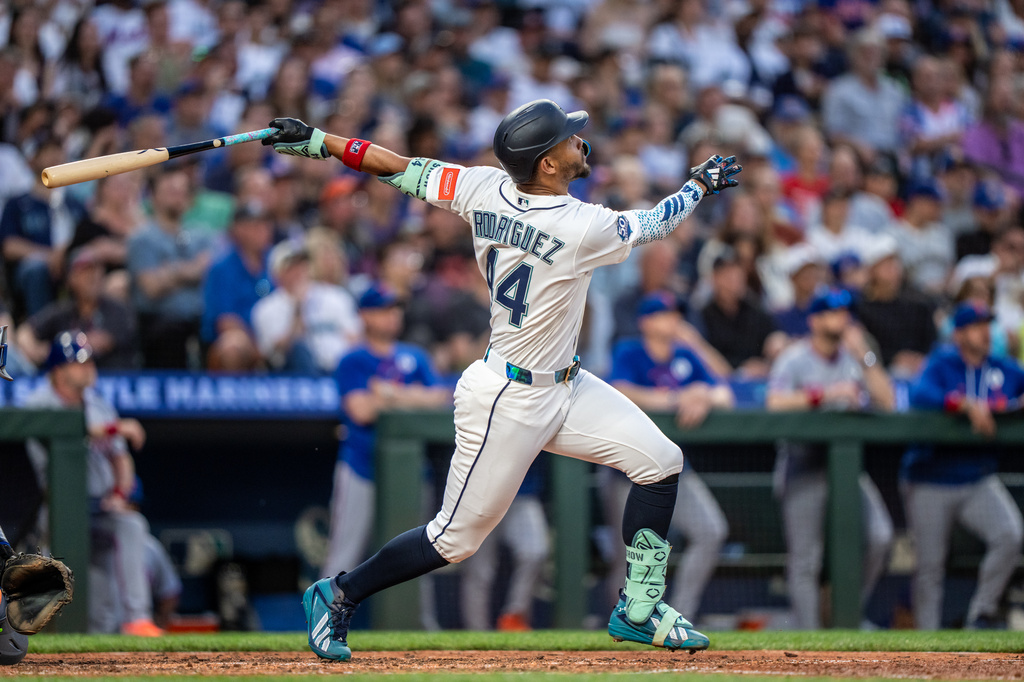 Seattle Mariners' Julio Rodriguez hits a solo home run during the sixth inning of a baseball game against the New York Mets, Tuesday, June 2, 2026, in Seattle. (AP Photo/Stephen Brashear)