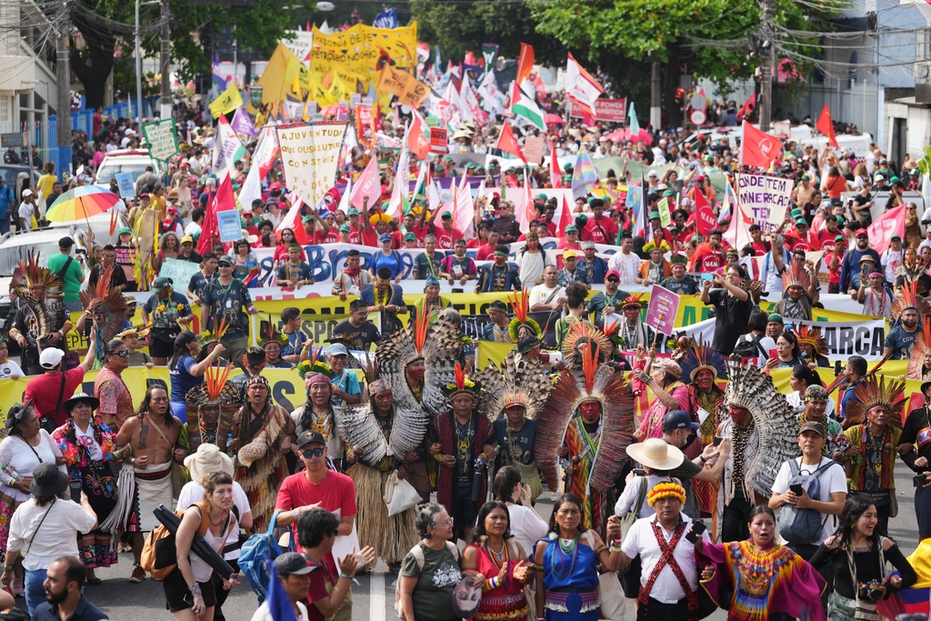 Activists participate in a climate protest during the COP30 U.N. Climate Summit, Saturday, Nov. 15, 2025, in Belem, Brazil. (AP Photo/Andre Penner)