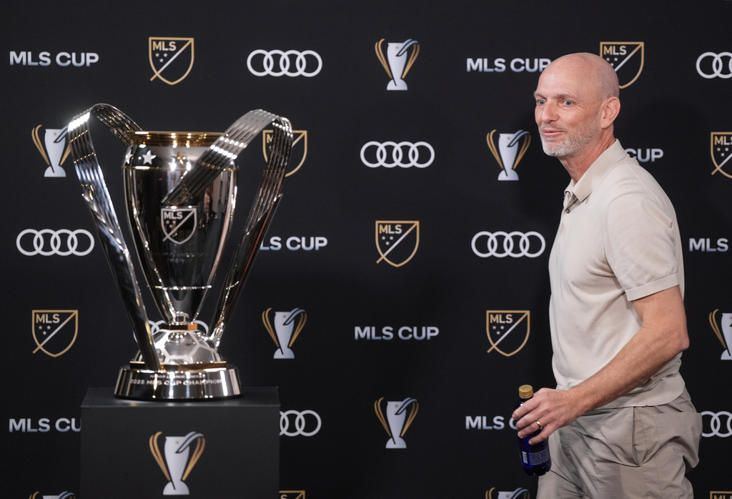 Vancouver Whitecaps head coach Jesper Sorensen walks past the MLS cup trophy as he leaves after a news conference Thursday, Dec. 4, 2025, in Fort Lauderdale, Fla., ahead of Saturday's of the MLS Cup soccer match against Inter Miami. (Darryl Dyck/The Canadian Press via