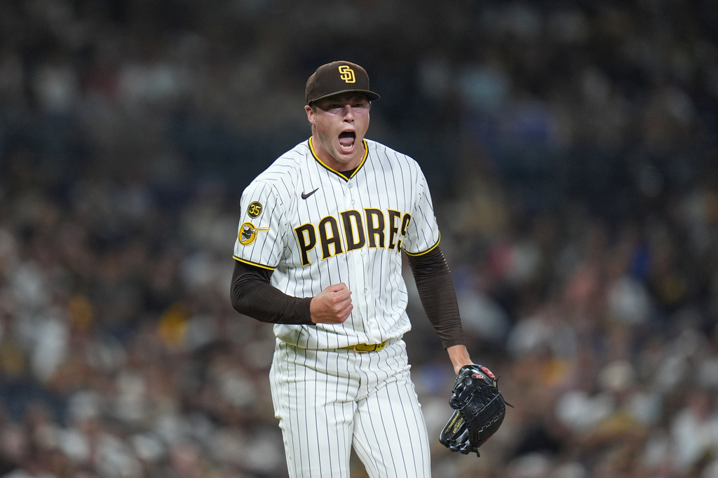 San Diego Padres pitcher Mason Miller celebrates after the third out of the ninth inning of a baseball game against the Colorado Rockies Tuesday, July 28, 2026, in San Diego. (AP Photo/Gregory Bull)