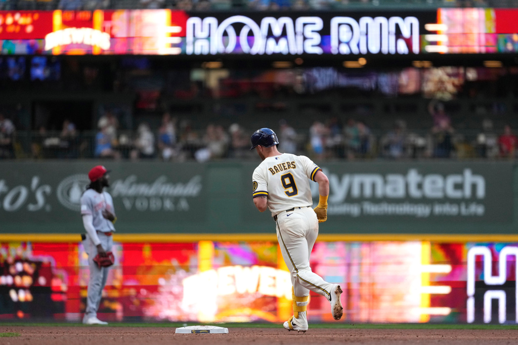 Milwaukee Brewers' Jake Bauers rounds the bases after hitting a solo home run during the fifth inning of a baseball game against the Cincinnati Reds, Tuesday, June 30, 2026, in Milwaukee. (AP Photo/Aaron Gash)