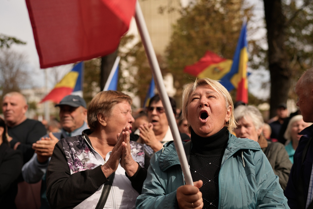 People attend a protest of the Russia-friendly Patriotic Electoral Bloc in Chisinau, Moldova, Monday, Sept. 29, 2025, after the parliamentary election. (AP Photo/Vadim Ghirda)
