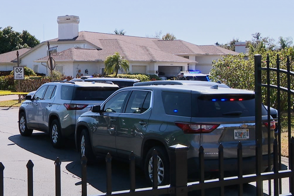 In this image taken from video provided by WFTS, law enforcement officers investigate a scene, Wednesday, Feb. 11, 2026, in Sarasota, Fla., which authorities say is connected to another crime scene, in Fort Lauderdale, Fla. (WFTS via AP)