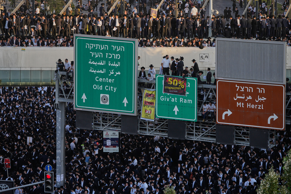 Ultra-Orthodox Jewish men protest against plans to force them to serve in the Israeli military, in Jerusalem, Thursday, Oct. 30, 2025. (AP Photo/Ohad Zwigenberg)
