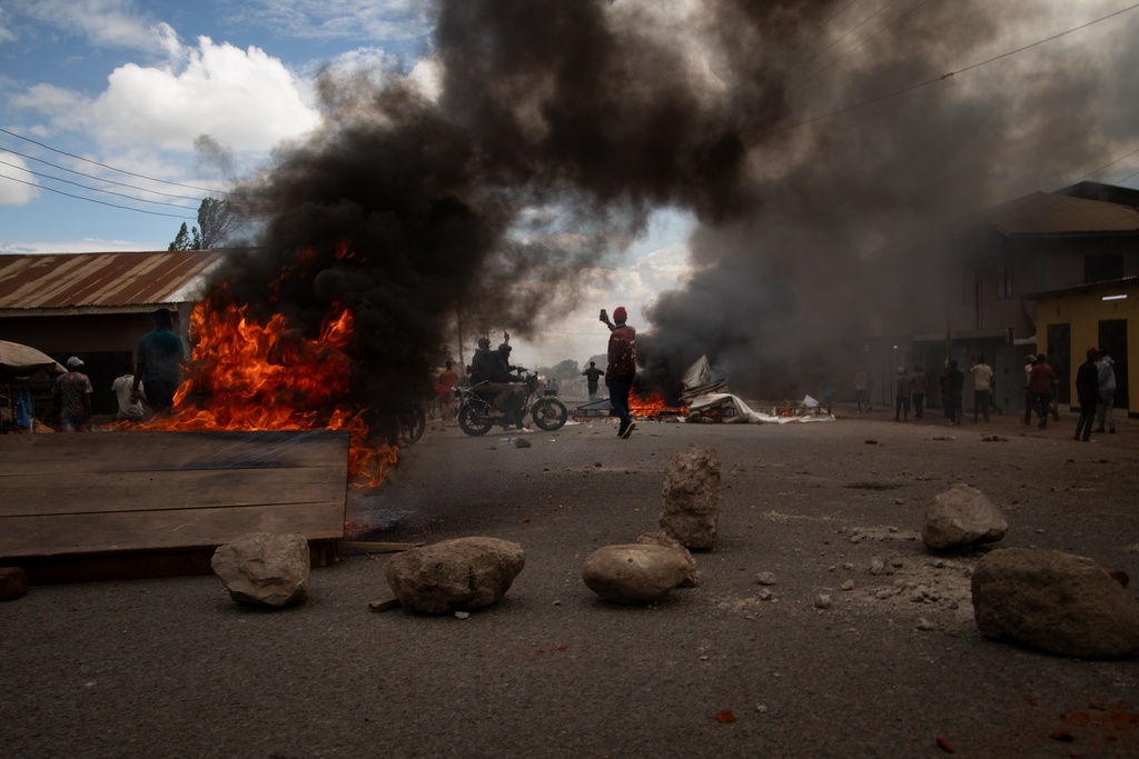 People protest in the streets of Arusha, Tanzania, on election day Wednesday, Oct. 29, 2025. (AP Photo/str)