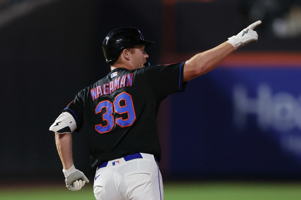 New York Mets first baseman Eric Wagaman (39) gestures after hitting a two-run home run during the sixth inning of a baseball game against the Chicago Cubs, Thursday, June 25, 2026, in New York. (AP Photo/Heather Khalifa)