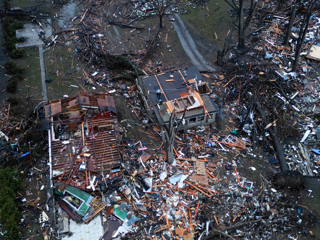 Debris from destroyed homes and property along South Sandbar Road following last night's tornado on Wednesday, March 11, 2026, in Aroma Park, Ill. (Stacey Wescott/Chicago Tribune via AP)
