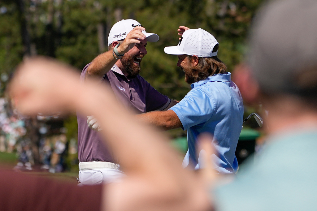 Shane Lowry, of Ireland, waves after a hole-in-one on the sixth hole during the third round of the Masters golf tournament at the Augusta National Golf Club, Saturday, April 11, 2026, in Augusta, Ga. (AP Photo/Ashley Landis)