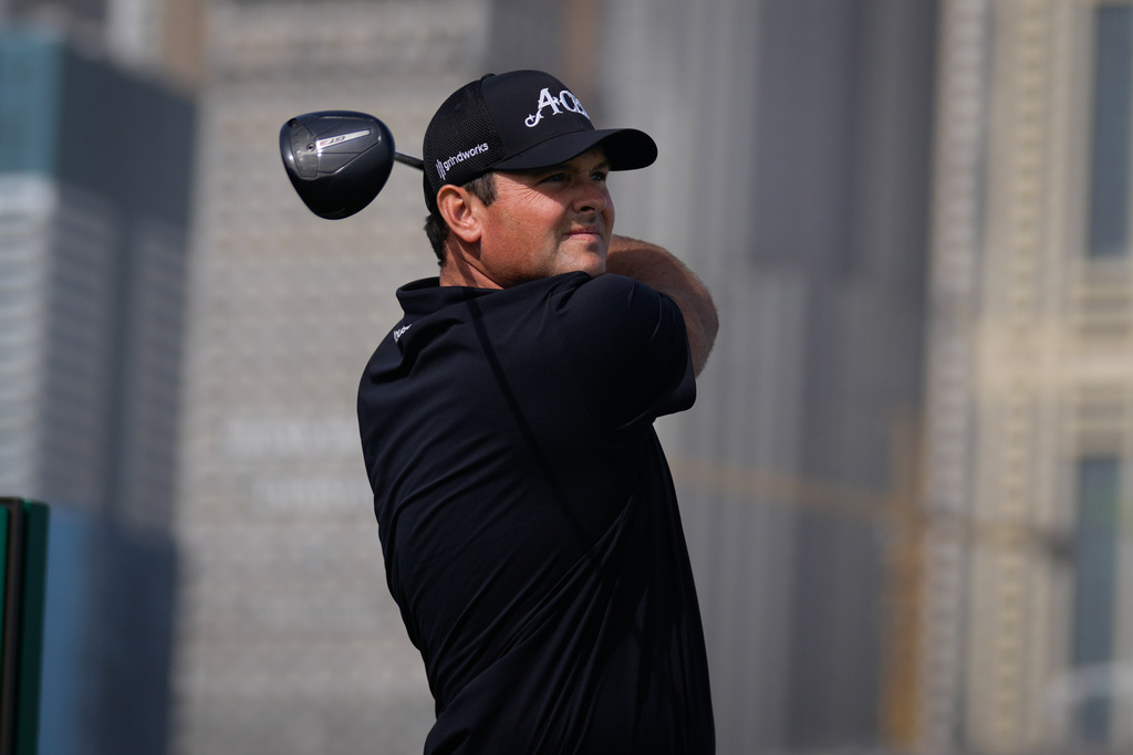 Patrick Reed of the United States watches the ball after teeing off at first hole during second round of the Dubai Desert Classic in United Arab Emirates, Friday, Jan. 23, 2026. (AP Photo/Altaf Qadri)