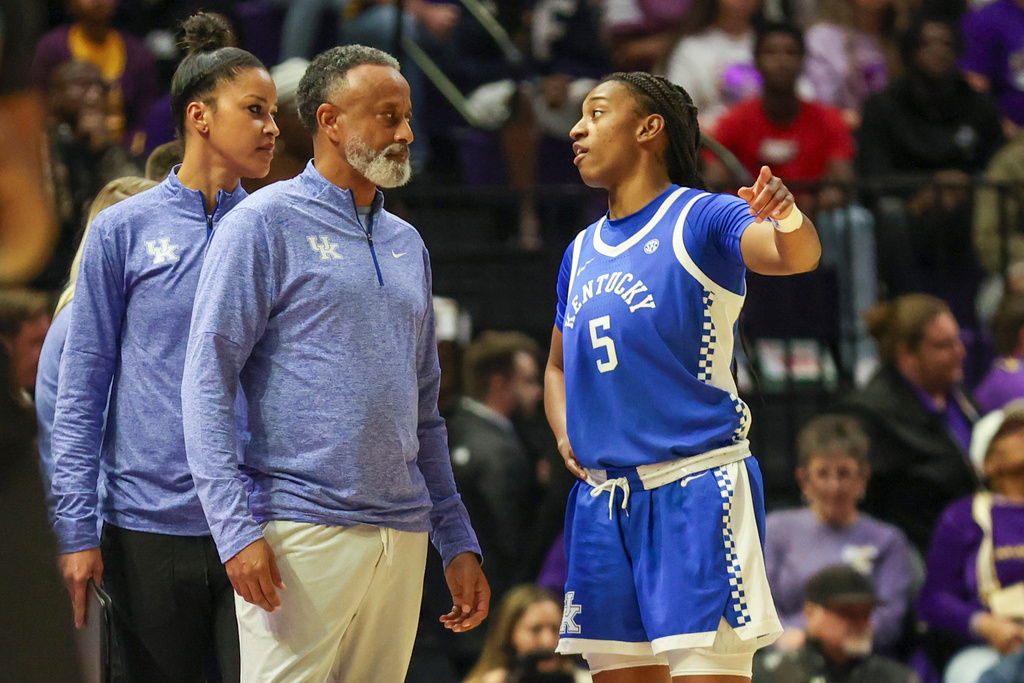 Kentucky head coach Kenny Brooks talks to guard Tonie Morgan (5) in the first half of an NCAA college basketball game against LSU in Baton Rouge, La., Thursday, Jan. 1, 2026. (AP Photo/Peter Forest)