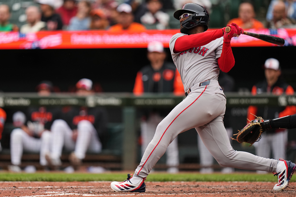 Boston Red Sox' Andruw Monasterio follows through on a grand slam during the ninth inning of a baseball game against the Baltimore Orioles, Saturday, April 25, 2026, in Baltimore. (AP Photo/Stephanie Scarbrough)