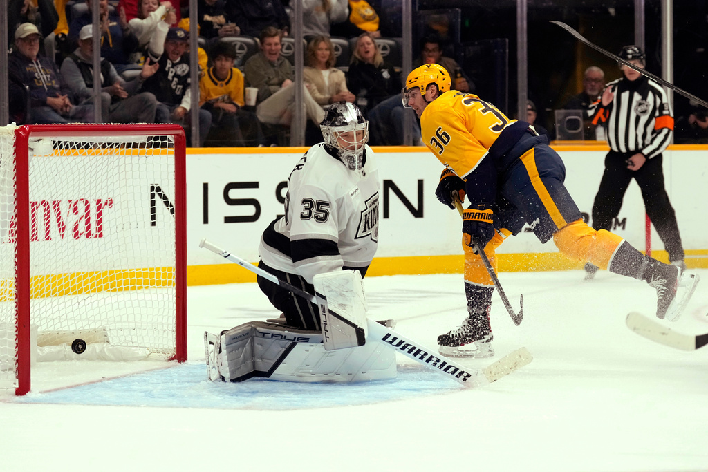 Nashville Predators left wing Cole Smith (36) scores a goal against Los Angeles Kings goaltender Darcy Kuemper (35) during the second period of an NHL hockey game Saturday, Oct. 25, 2025, in Nashville, Tenn. (AP Photo/Mark Humphrey)