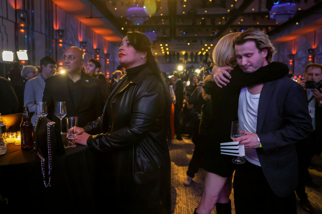 Josh Tepper, right, and Suzanne Murphy hug during an election nigh watch party for independent mayoral candidate Andrew Cuomo, Tuesday, Nov. 4, 2025, in New York. (AP Photo/Heather Khalifa)